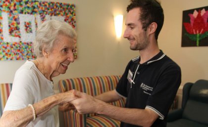 Daniel Innes with a resident ... "every morning the stereo went on and I was on my feet, being led around the make-shift dancefloor"